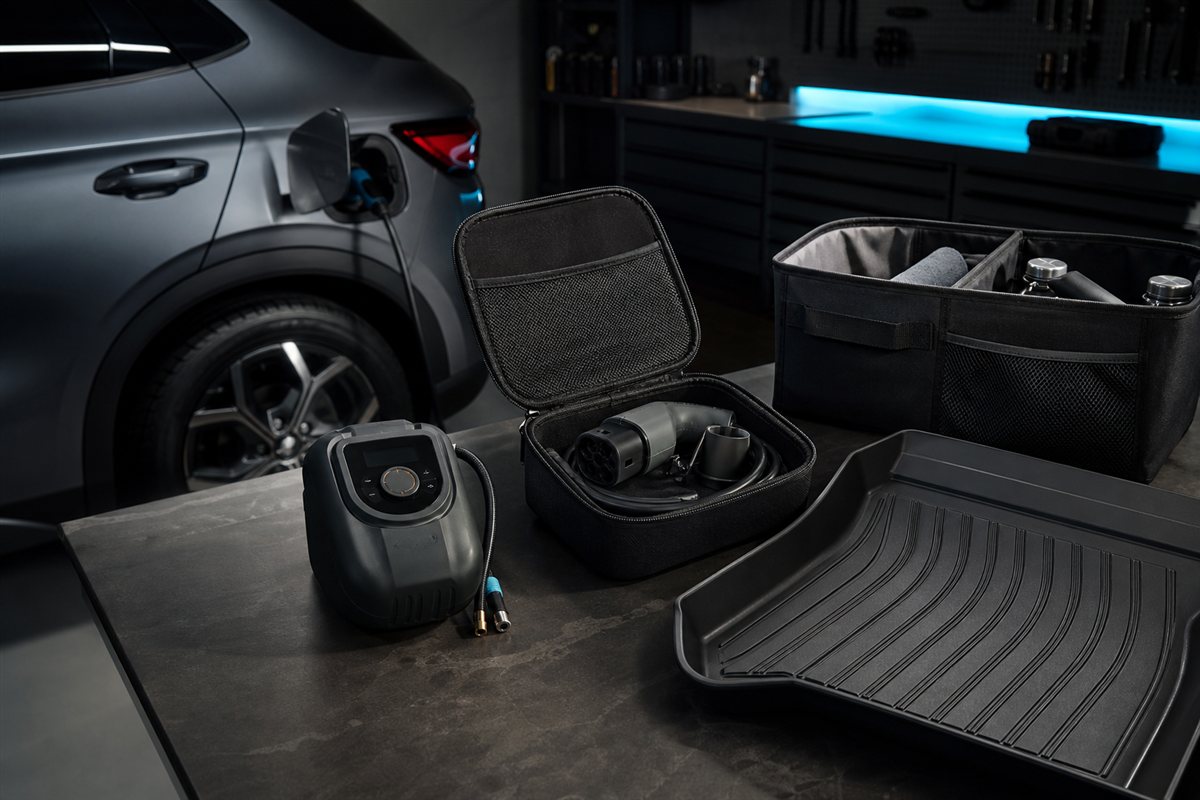 Practical EV charging and cargo accessories on a garage workbench